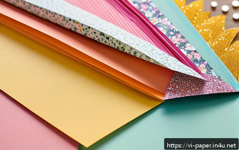 종이공예 팁과 트릭 - A detailed close-up of a creative paper crafting workspace featuring various types of paper includin...