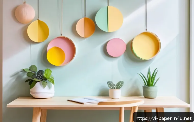 종이 아트 인테리어 - A modern minimalist interior room featuring delicate pastel-colored paper decorations: simple geomet...